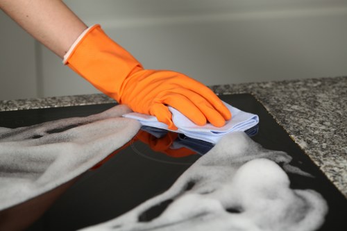 Office cleaning team sanitizing shared surfaces in a Kingston business